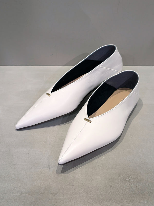 Metal motif slip-on shoes