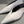 Metal motif slip-on shoes