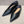 Metal motif slip-on shoes