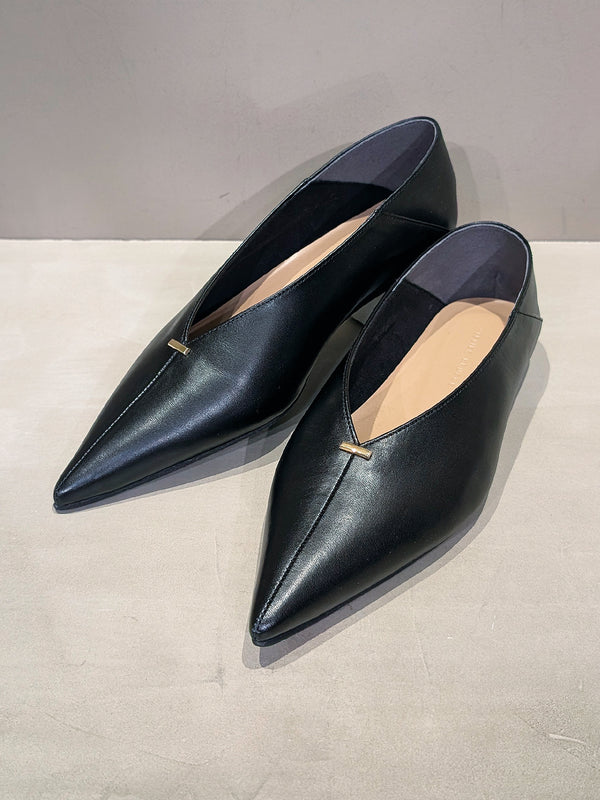 Metal motif slip-on shoes