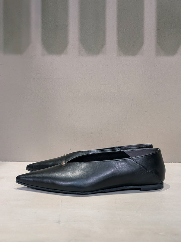 Metal motif slip-on shoes