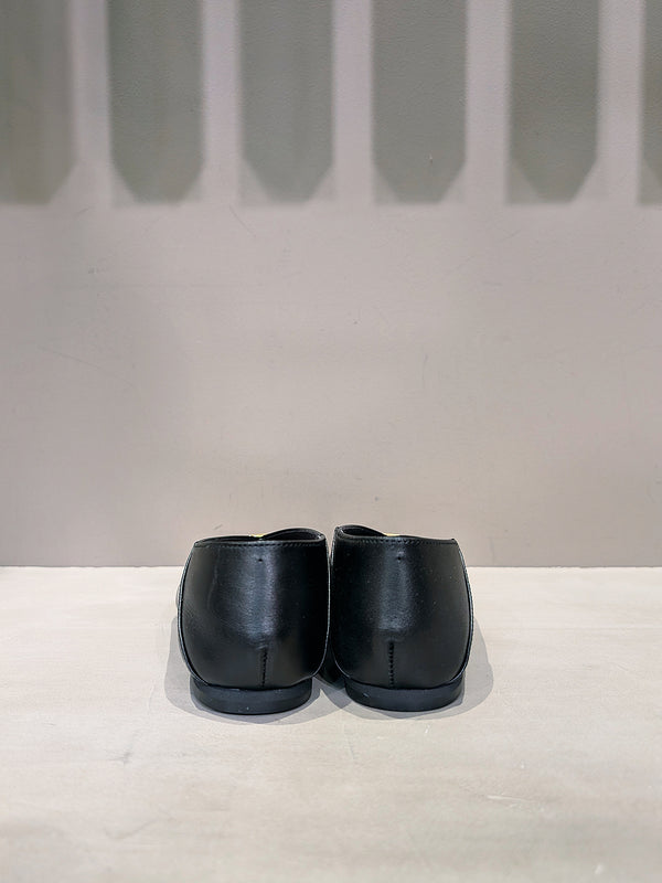 Metal motif slip-on shoes